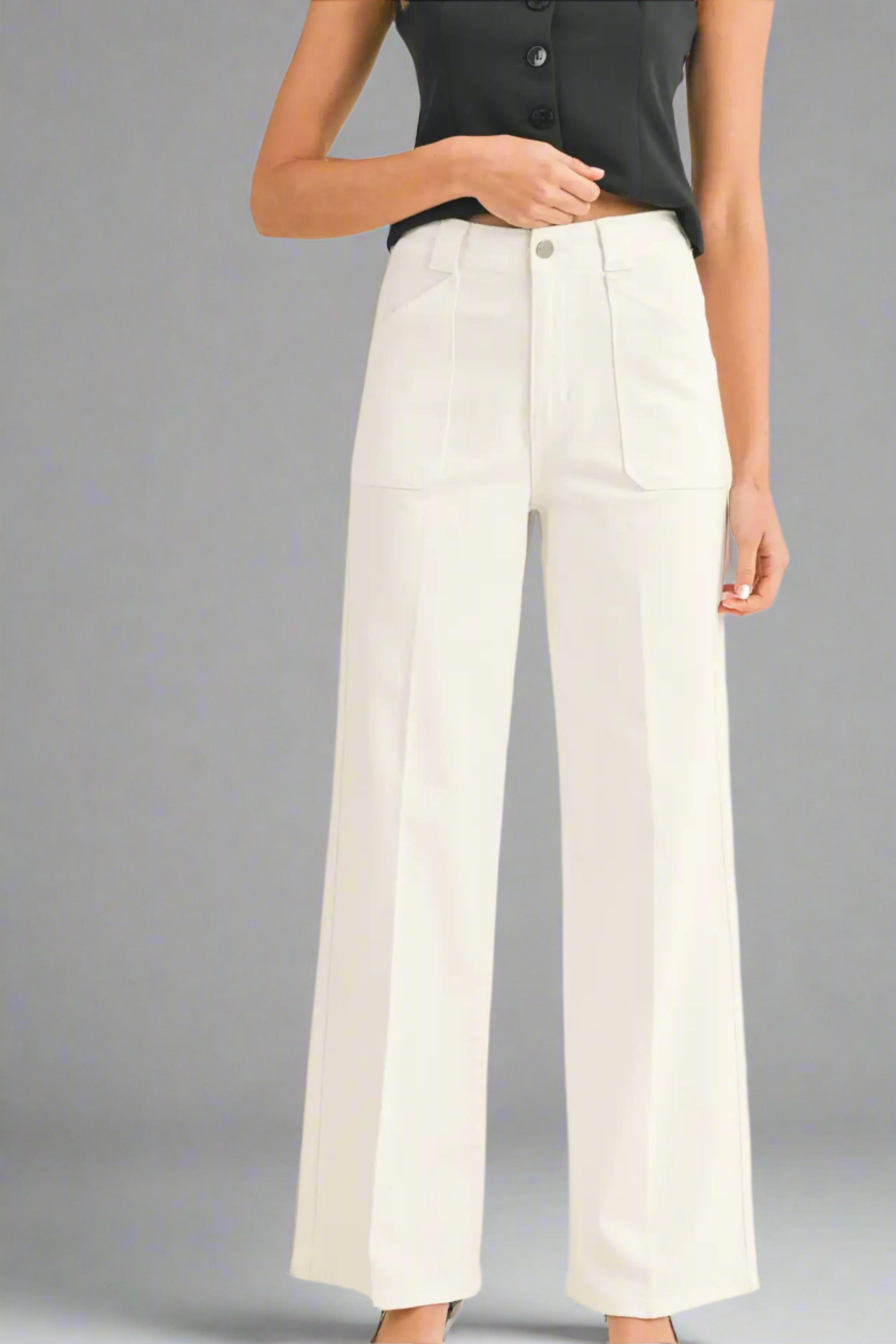 White wide-leg pants worn by a person on a white background