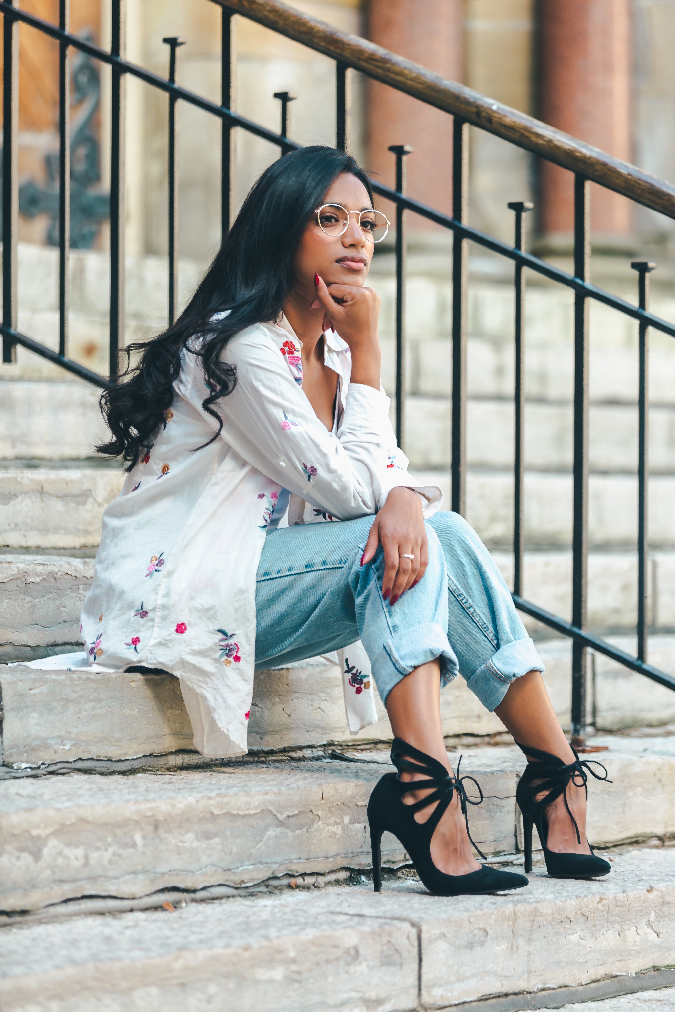 fashionable-woman-sitting-on-stairs.jpg