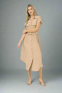 Woman wearing a beige dress on a white background