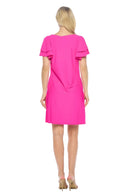 Woman wearing a bright pink dress on a white background