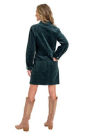 Woman wearing a green dress with a white background