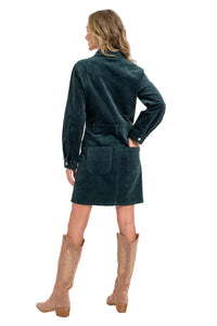 Woman wearing a green dress with a white background