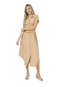 Woman wearing a beige dress on a white background