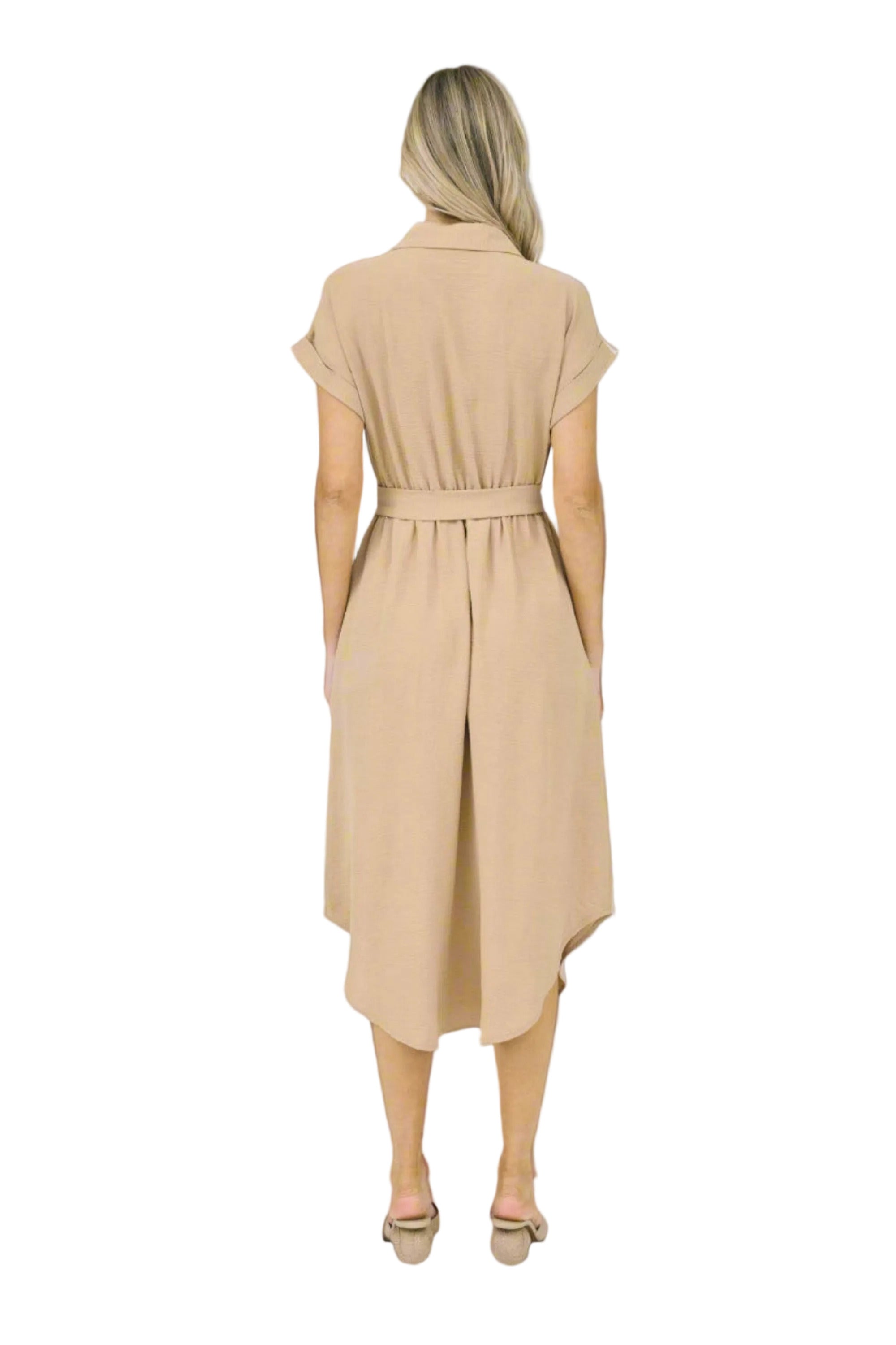 Woman wearing a beige dress on a white background