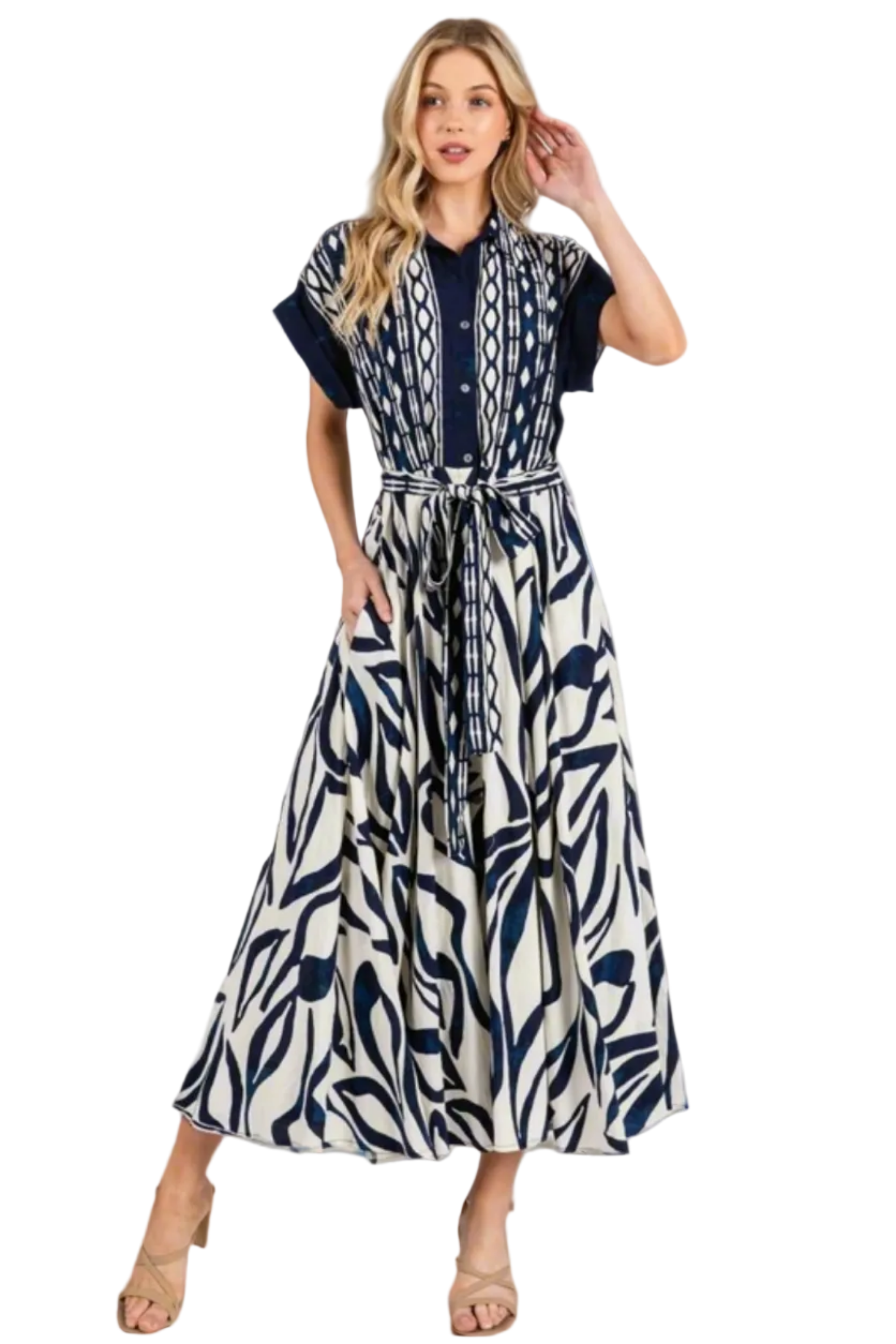 Woman wearing a blue and white patterned dress on a white background